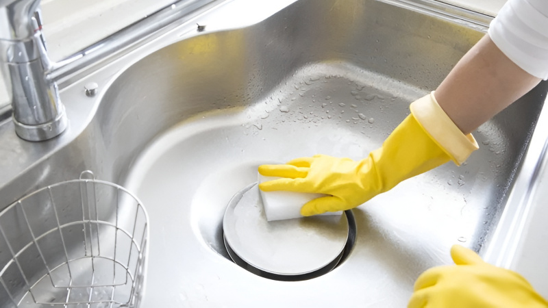 Use baking soda to remove odors and clean the dish sink