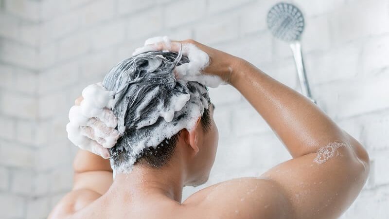 Limit washing your hair with hot water
