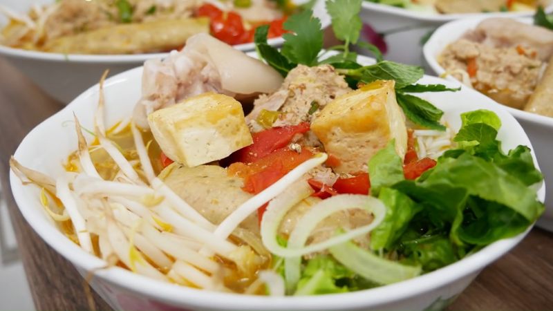 Bun Rieu Cua (Vietnamese Crab Noodle Soup) with pork belly