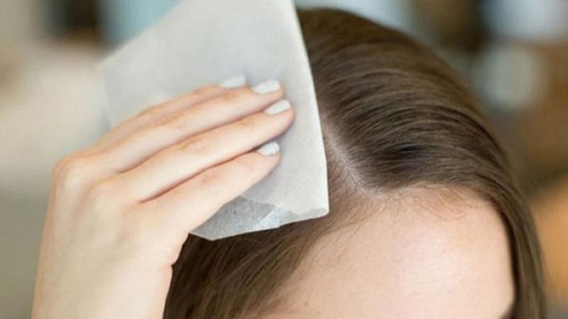 Blot dry your hair with a multi-purpose paper towel