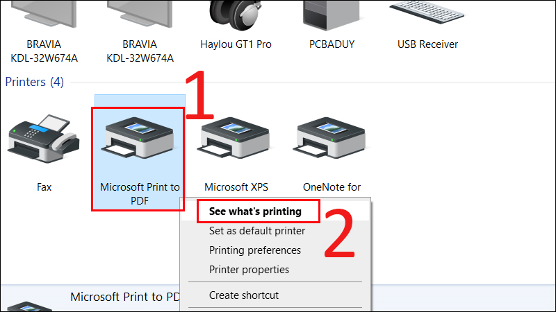  Click chuột phải vào máy in, chọn See what's printing